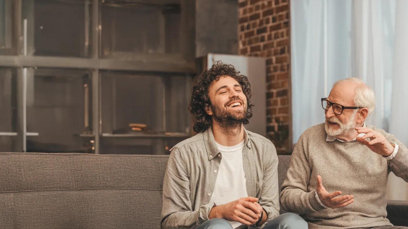 Two individuals smiling.