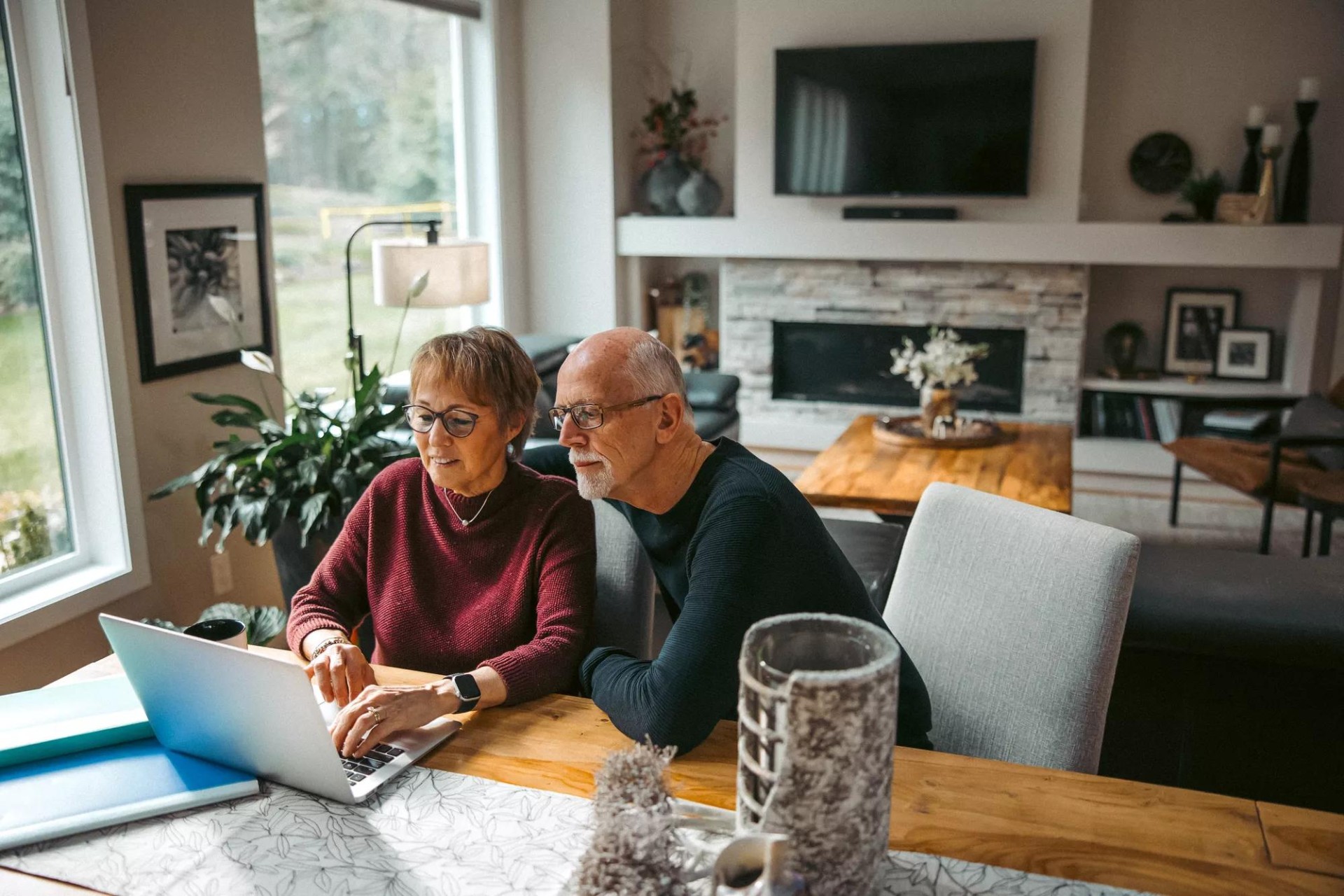 Joyful senior couple browsing dental plan